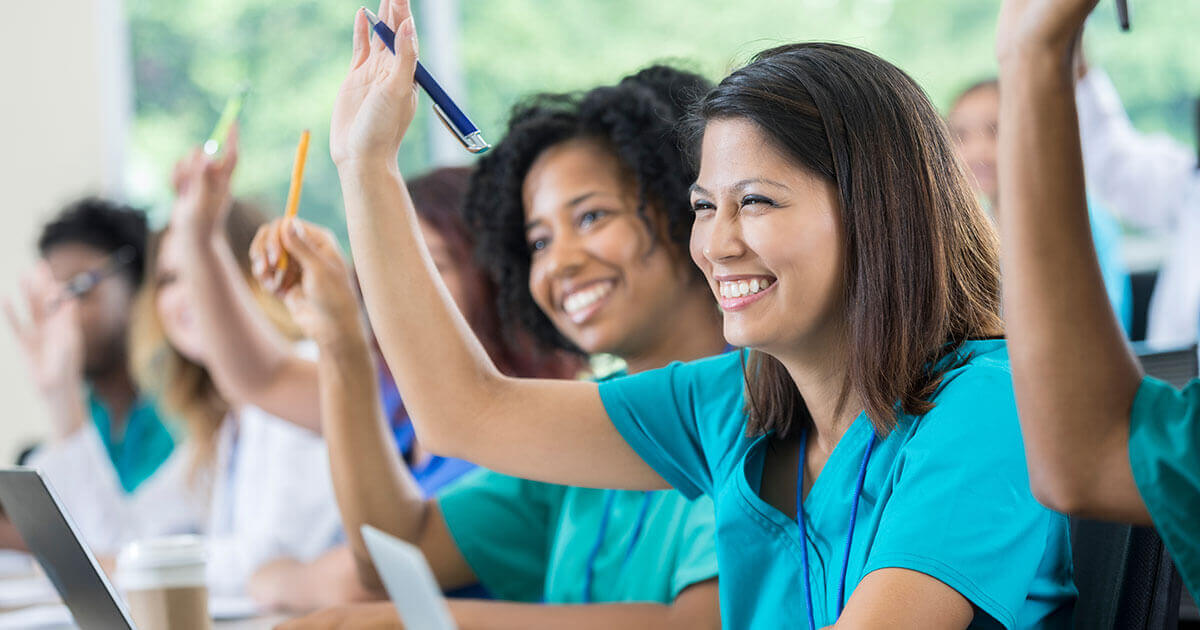 race-ethnicity-difference-medical-school medical students raising hand